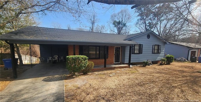 ranch-style home featuring a carport