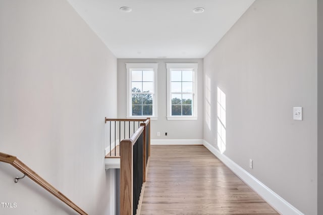 corridor with light hardwood / wood-style floors