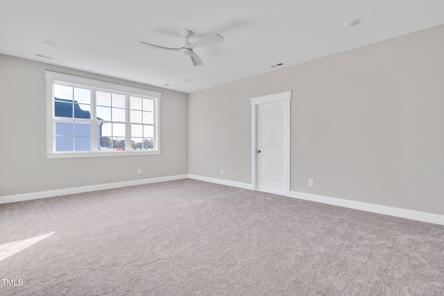 empty room with carpet floors and ceiling fan