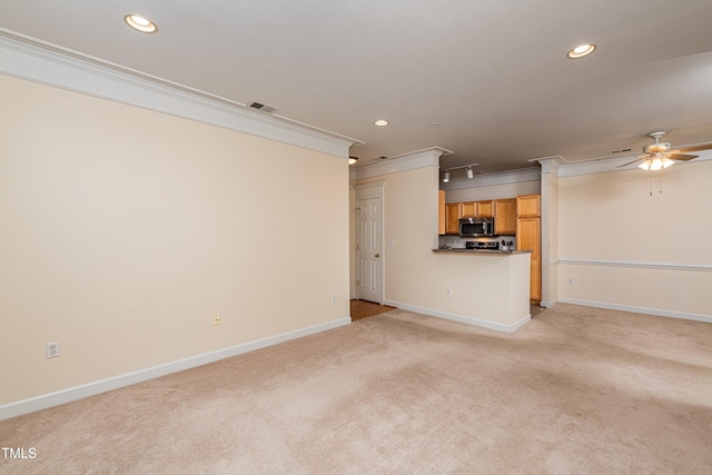 unfurnished living room with ornamental molding, light colored carpet, and ceiling fan