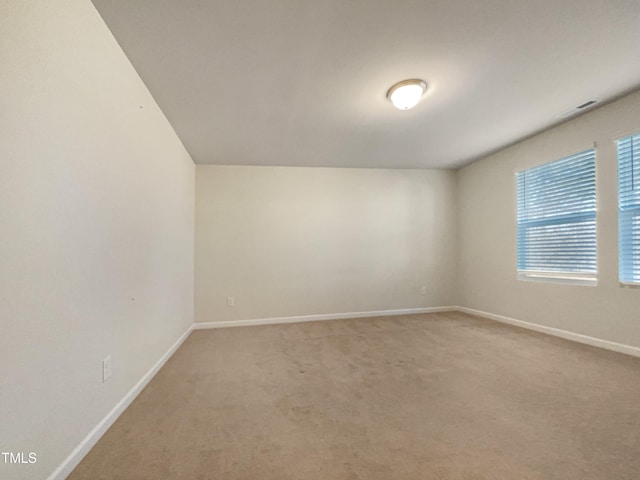 unfurnished room featuring carpet flooring