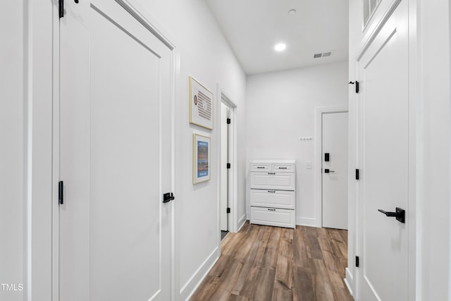 hallway featuring hardwood / wood-style flooring