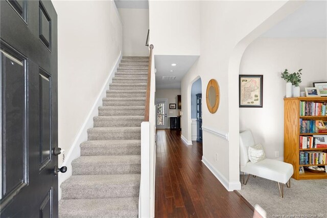 entrance foyer featuring dark hardwood / wood-style floors