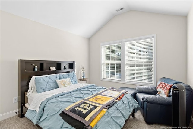 carpeted bedroom featuring vaulted ceiling