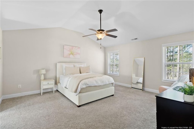 carpeted bedroom featuring vaulted ceiling and ceiling fan