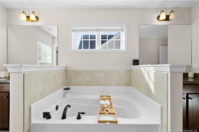 bathroom featuring vanity and a bathtub