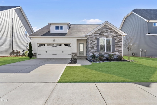 view of front of property featuring a garage and a front yard