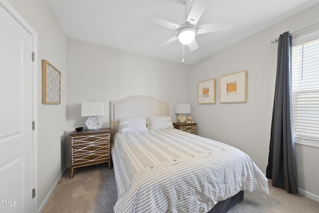 bedroom featuring dark carpet and ceiling fan