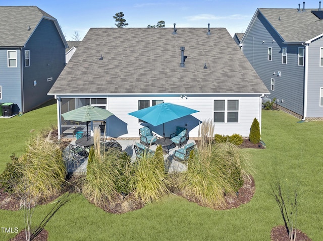 rear view of property featuring a yard and an outdoor living space