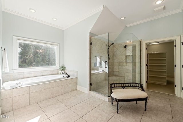 bathroom with tile patterned flooring, ornamental molding, and shower with separate bathtub