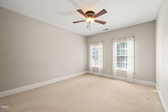 unfurnished room featuring ceiling fan and light colored carpet