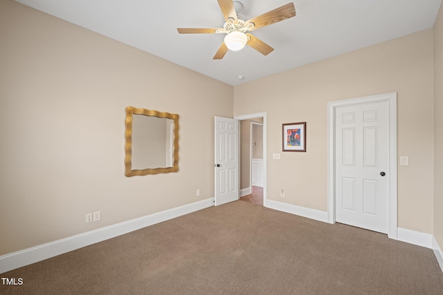 unfurnished bedroom featuring ceiling fan and carpet