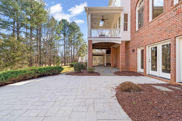 view of patio / terrace featuring ceiling fan and a balcony