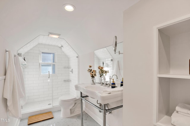 bathroom featuring lofted ceiling, tile patterned floors, toilet, and an enclosed shower