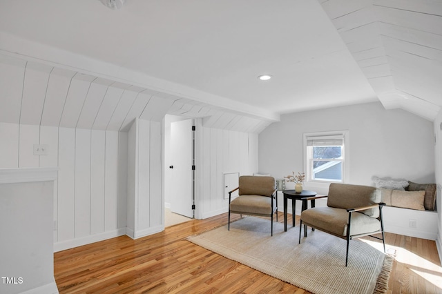 sitting room with lofted ceiling and light hardwood / wood-style floors