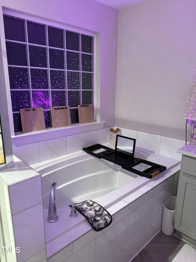 bathroom featuring tiled tub