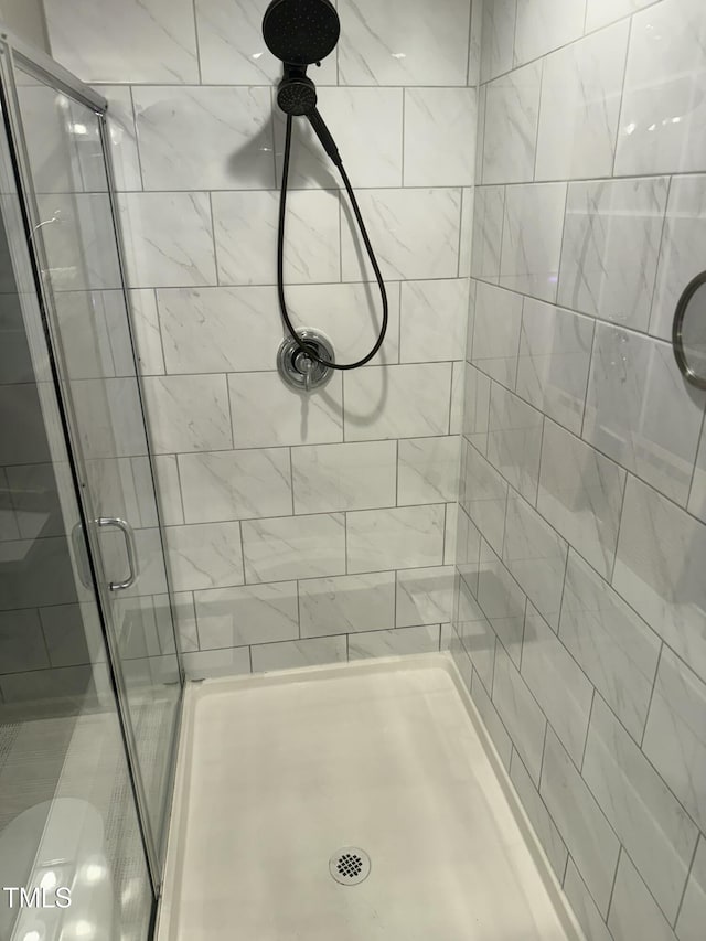 bathroom featuring a stall shower