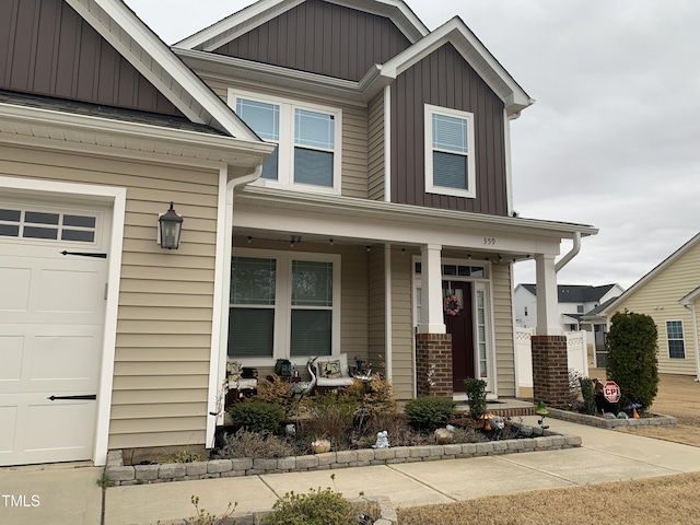 craftsman-style house featuring a garage and covered porch