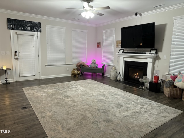 living area featuring dark wood-style floors, visible vents, and ornamental molding