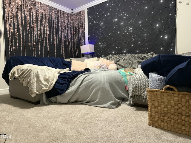 carpeted bedroom with ornamental molding and wallpapered walls