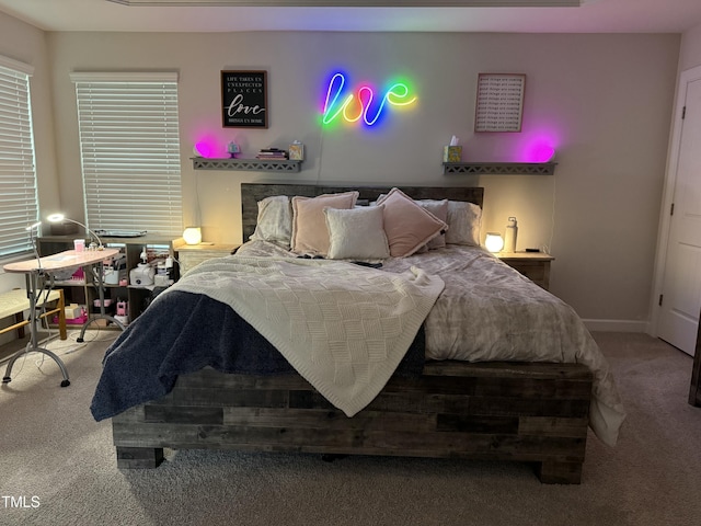 carpeted bedroom with baseboards