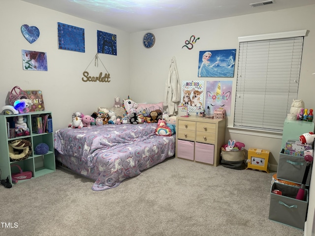 bedroom featuring light carpet and visible vents