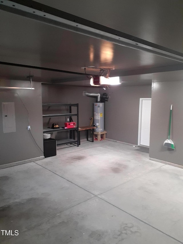 garage with a garage door opener, electric panel, and water heater