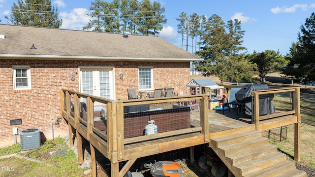 wooden terrace with central AC unit and a grill