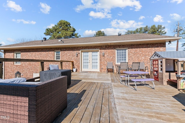 wooden terrace featuring french doors