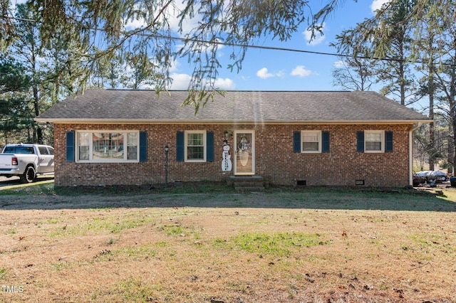 ranch-style house featuring a front lawn, brick siding, roof with shingles, and crawl space