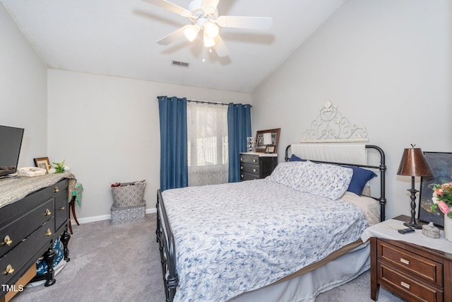 bedroom featuring lofted ceiling, light colored carpet, and ceiling fan