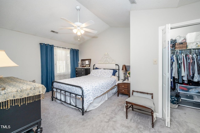 carpeted bedroom featuring lofted ceiling, a closet, and ceiling fan