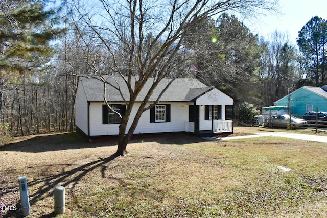 view of front of home with a front yard and a porch