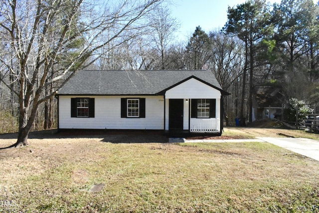 single story home with a front yard and covered porch