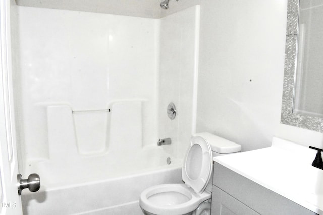 full bathroom with shower / washtub combination, toilet, and vanity