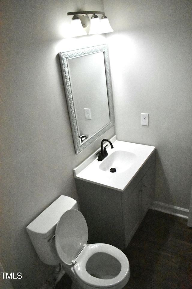 bathroom with vanity and toilet