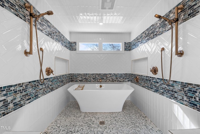2035 Stuart Ct, Burlington, NC 27215 - bathroom with tile walls and a soaking tub