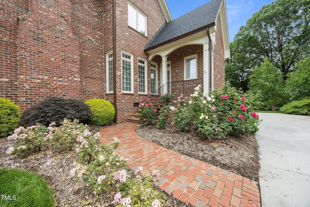2035 Stuart Ct, Burlington, NC 27215 - entrance to property featuring brick siding, driveway, and a shingled roof
