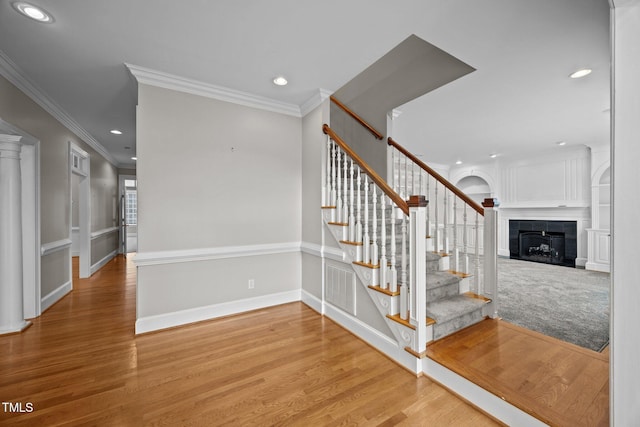 2035 Stuart Ct, Burlington, NC 27215 - stairs with a tiled fireplace, recessed lighting, wood finished floors, ornamental molding, and baseboards