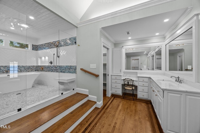 2035 Stuart Ct, Burlington, NC 27215 - bathroom with a shower stall, vanity, wood finished floors, ornamental molding, and a freestanding tub