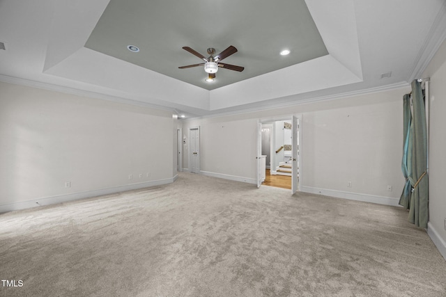 2035 Stuart Ct, Burlington, NC 27215 - empty room with a raised ceiling, ceiling fan, stairway, carpet, and crown molding