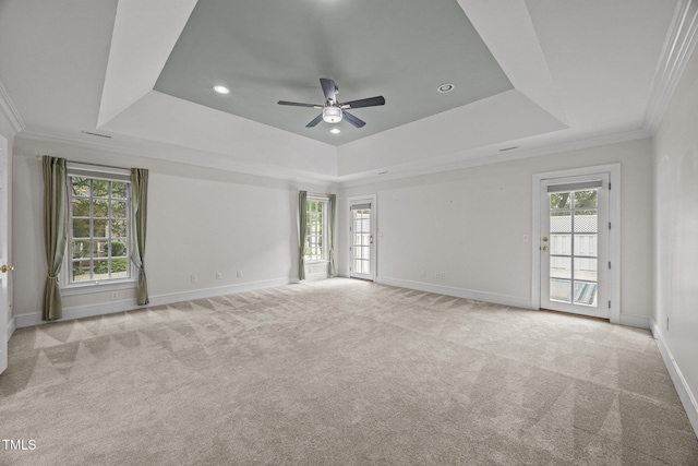 2035 Stuart Ct, Burlington, NC 27215 - empty room featuring a raised ceiling, baseboards, a ceiling fan, carpet flooring, and crown molding