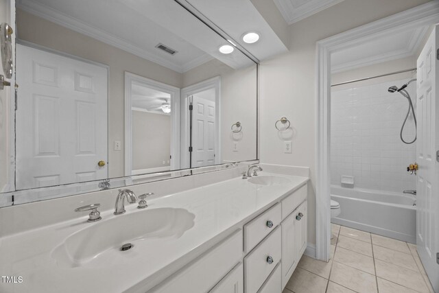 2035 Stuart Ct, Burlington, NC 27215 - bathroom with toilet, double vanity, shower / bathtub combination, tile patterned floors, and crown molding