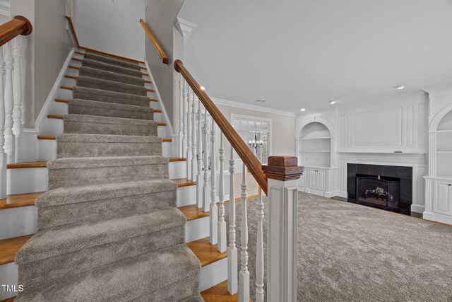 2035 Stuart Ct, Burlington, NC 27215 - stairs featuring built in features, ornamental molding, carpet flooring, recessed lighting, and a fireplace