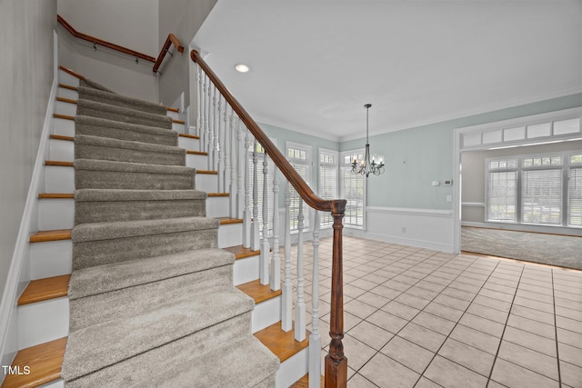 2035 Stuart Ct, Burlington, NC 27215 - stairs with tile patterned floors, a chandelier, crown molding, healthy amount of natural light, and a wainscoted wall
