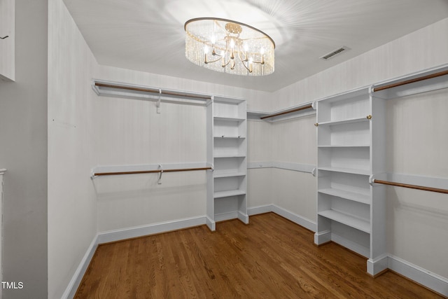 2035 Stuart Ct, Burlington, NC 27215 - spacious closet with wood finished floors and a chandelier