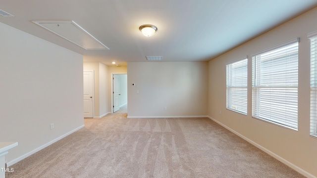 empty room featuring light carpet