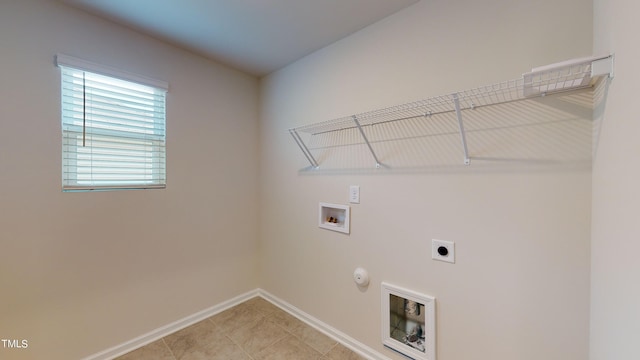 laundry area with hookup for a washing machine, gas dryer hookup, and electric dryer hookup