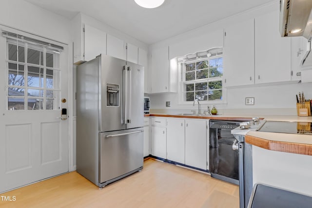 kitchen with dishwasher, high quality fridge, white cabinets, and light wood-type flooring