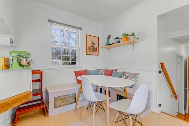 dining area featuring light wood-type flooring and breakfast area